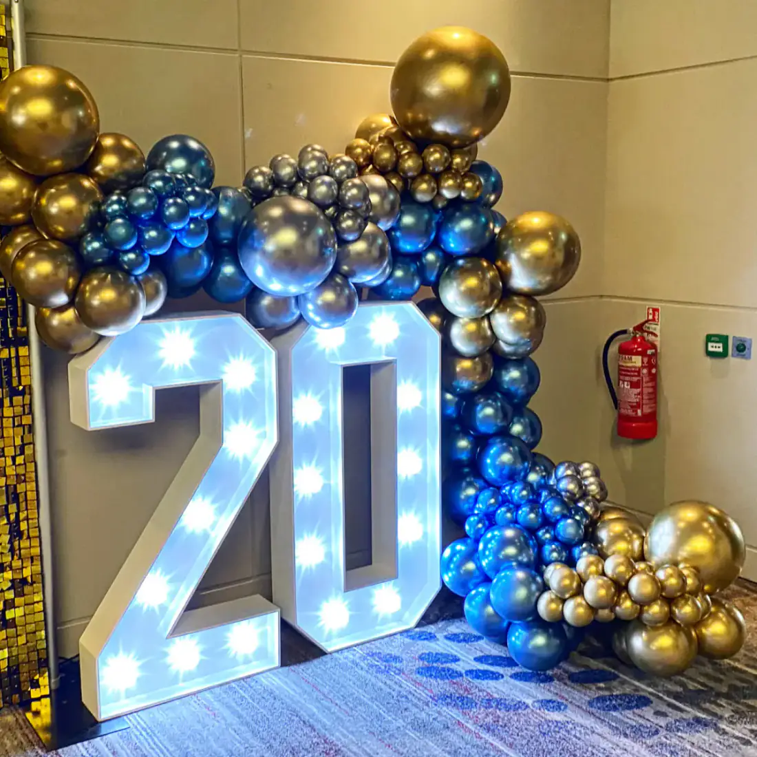 Blue and gold 20th birthday display with LED numbers