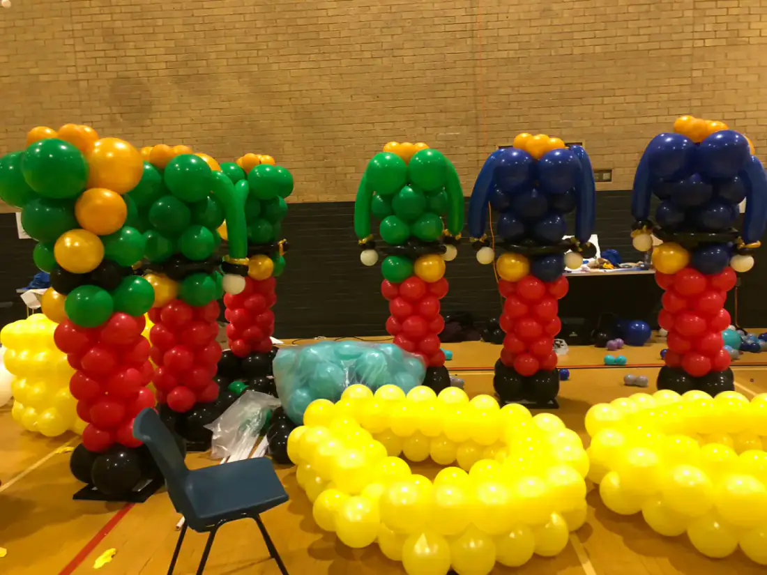 Character scene built from balloons inside The Castle installation