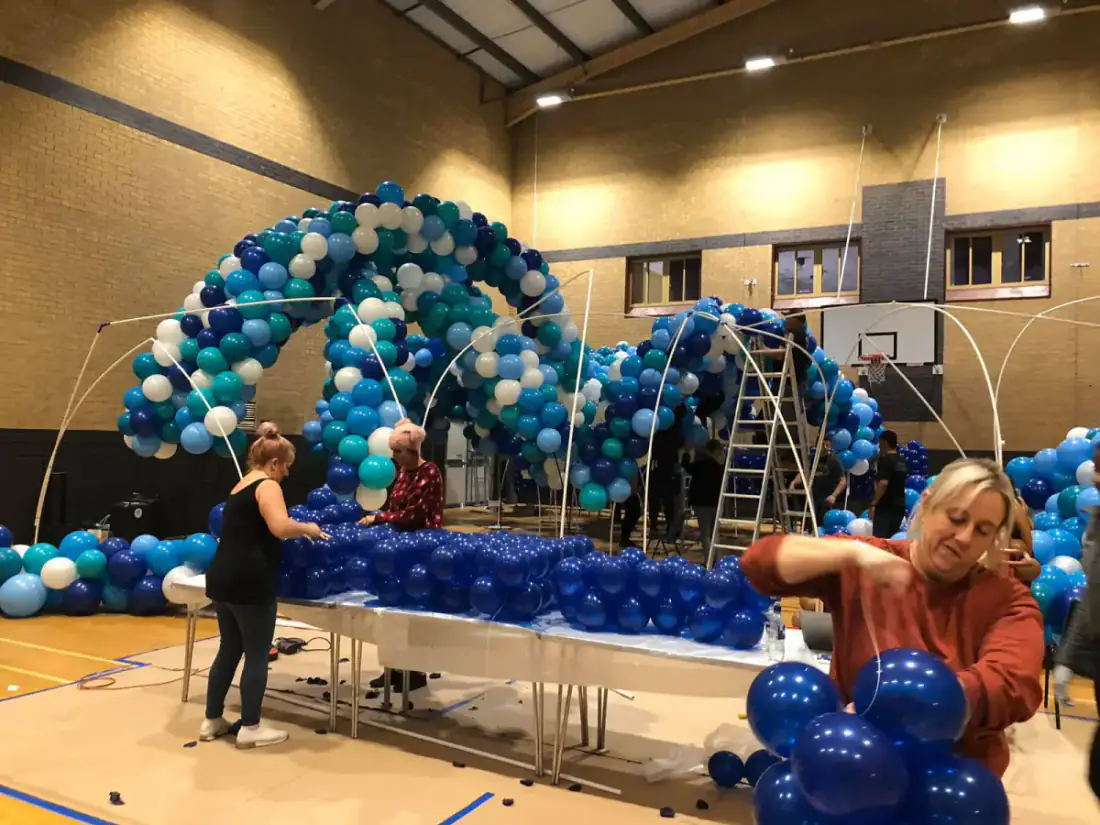 Wide view of Santa's Grotto within the 60,000 balloon Enchanted Forest build