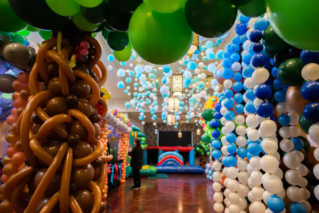Close detail of balloon tree trunks and organic balloon canopy