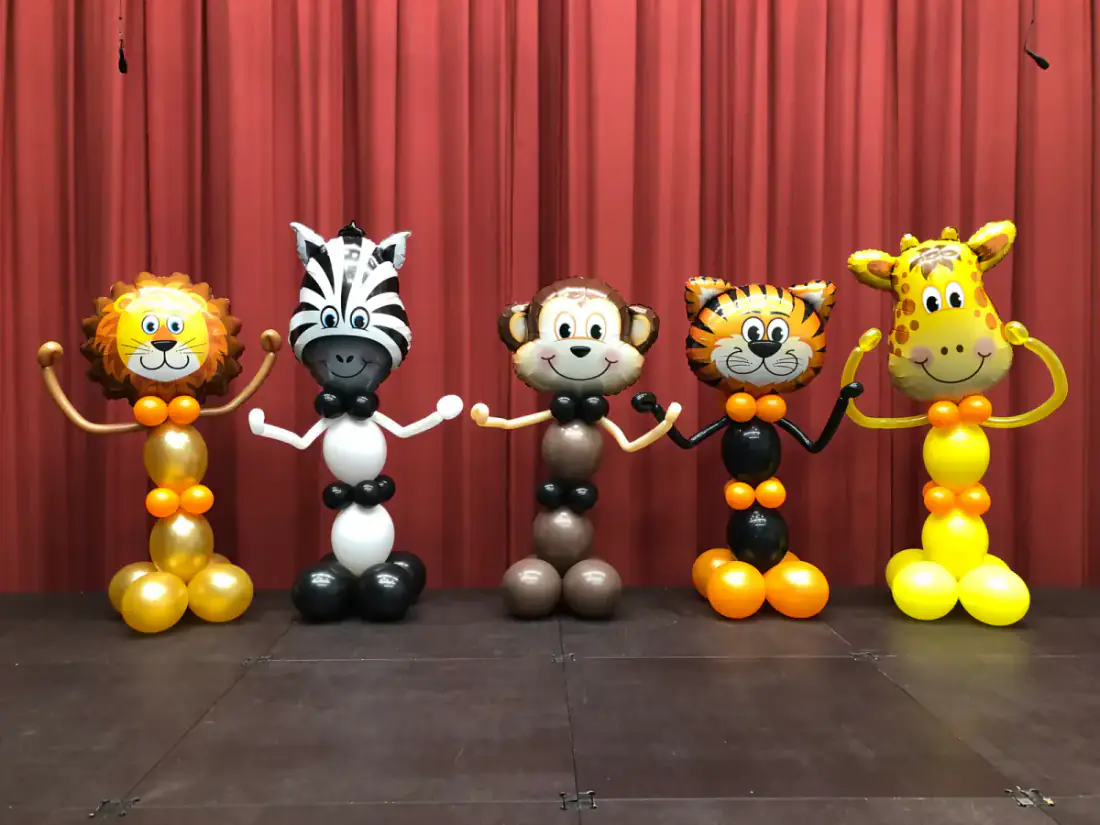 Safari animal balloon characters on a stage