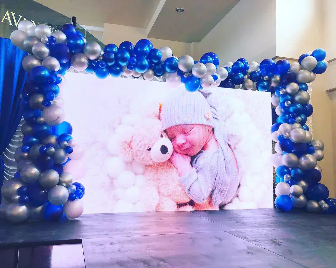 Blue and silver balloon frame around stage screen