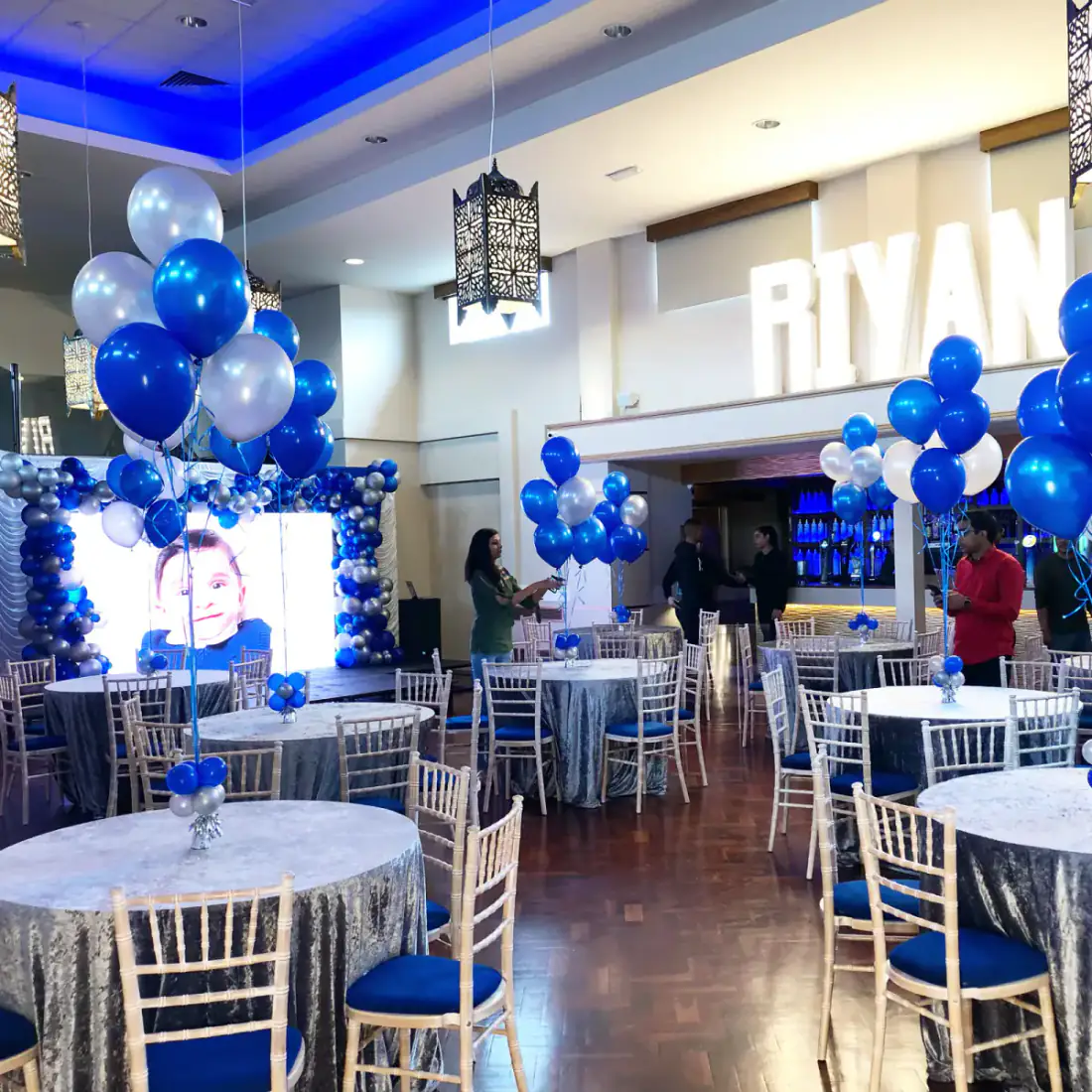 Blue and white children's birthday table balloon styling