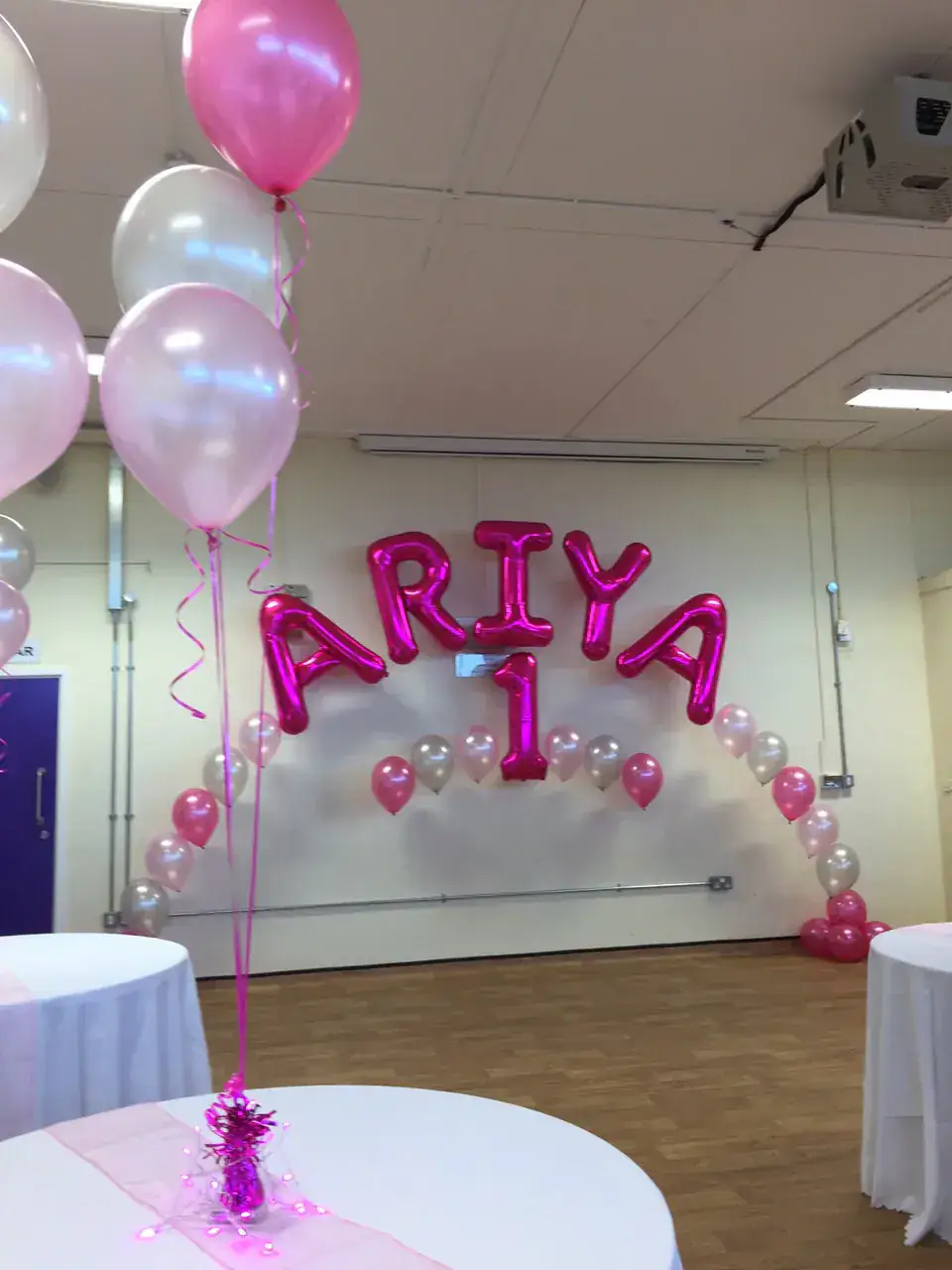Aria first birthday pink balloon wall with foil letters