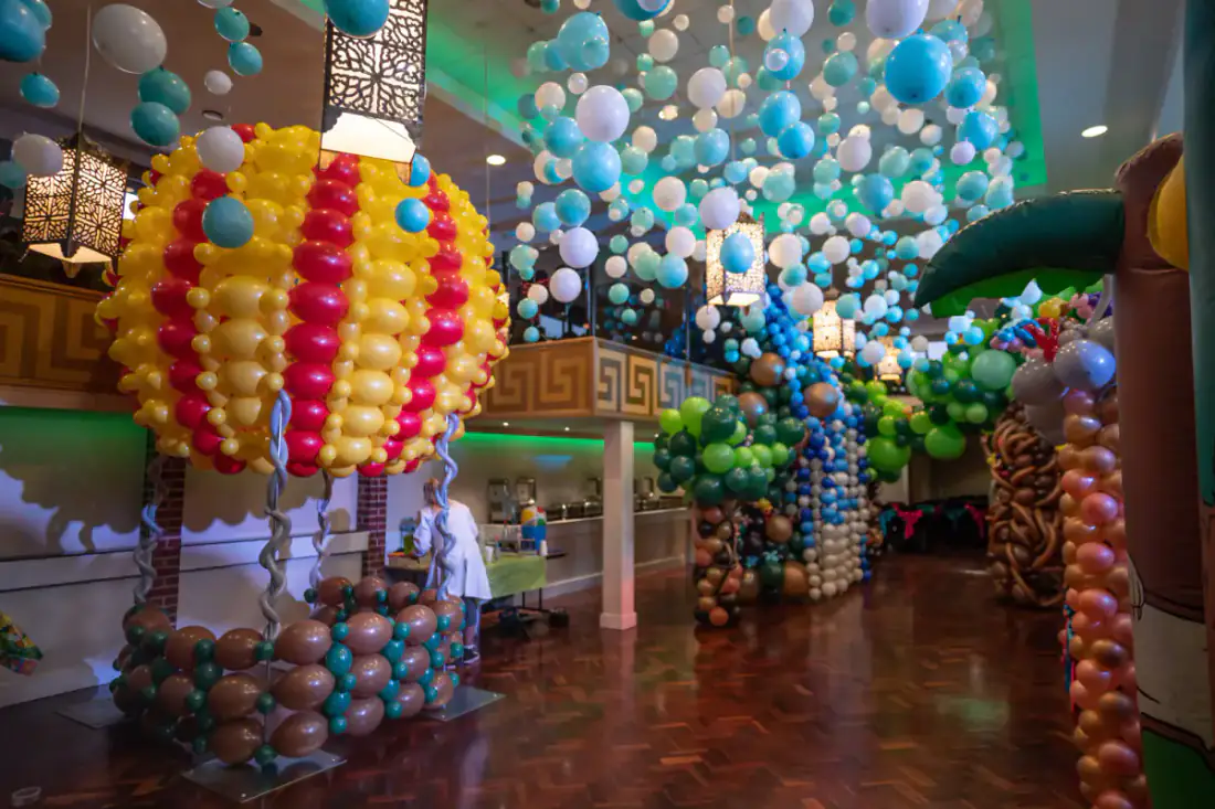 Hot air balloon themed party room with balloon installations