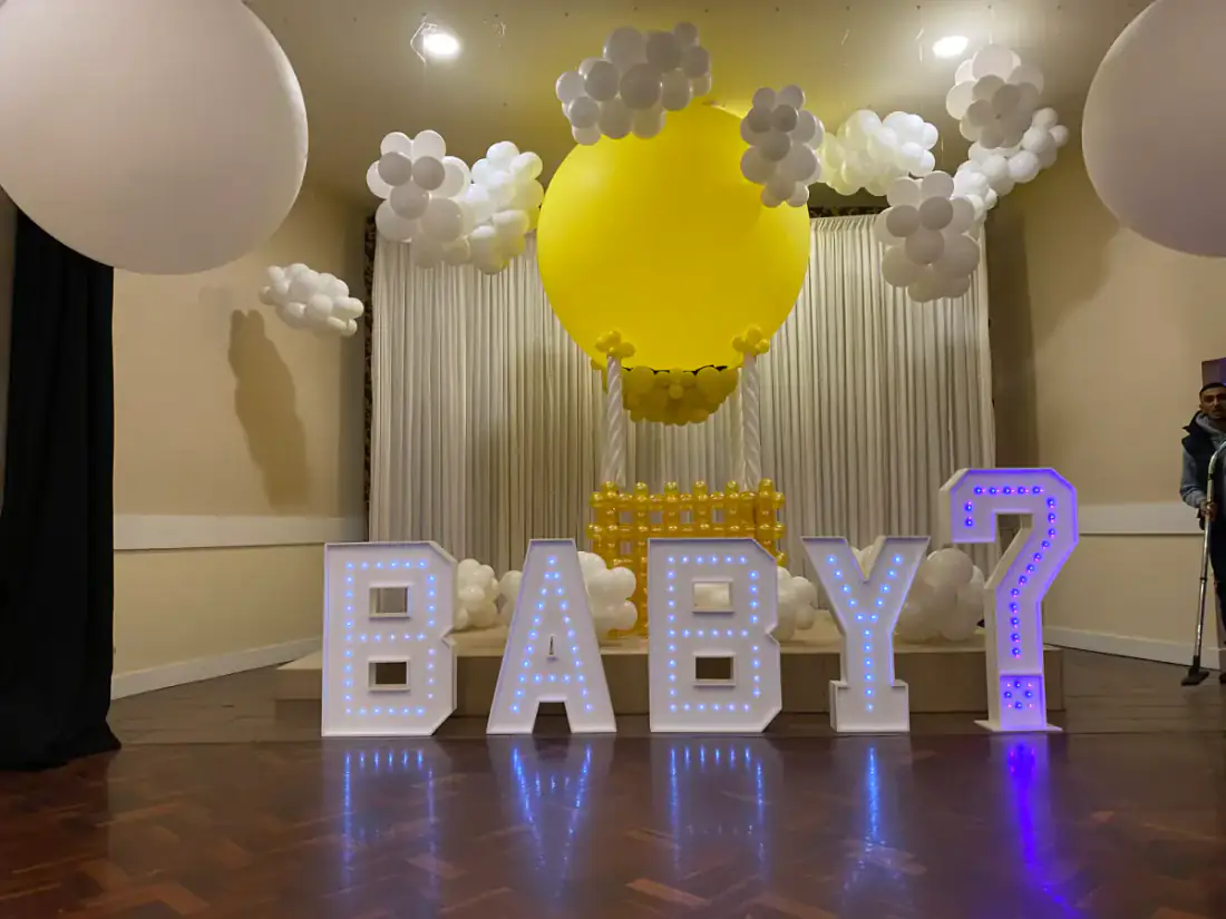 BABY LED letters with white and yellow balloon styling for a baby shower