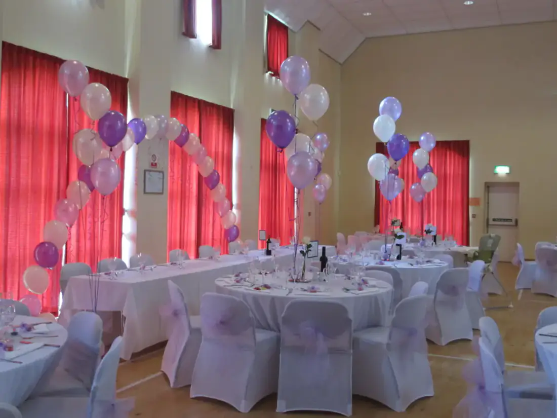 Wedding tables with lilac and silver balloon centrepieces